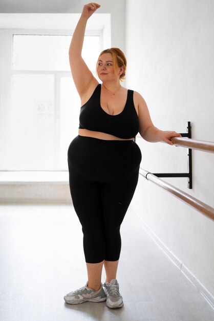 Full shot  professional plus size dancer training