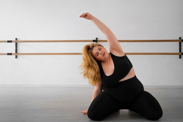 Full shot  professional plus size dancer training