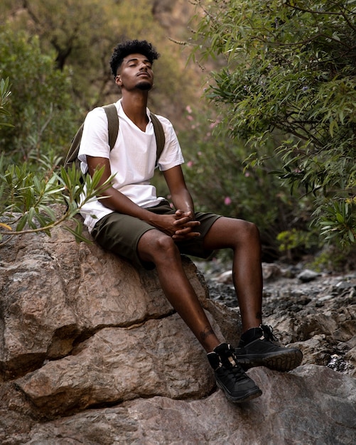 Full shot relaxed man with backpack