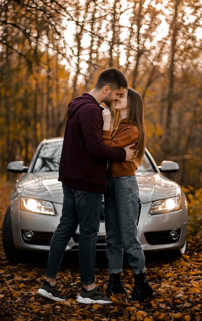 Full shot romantic couple in forest