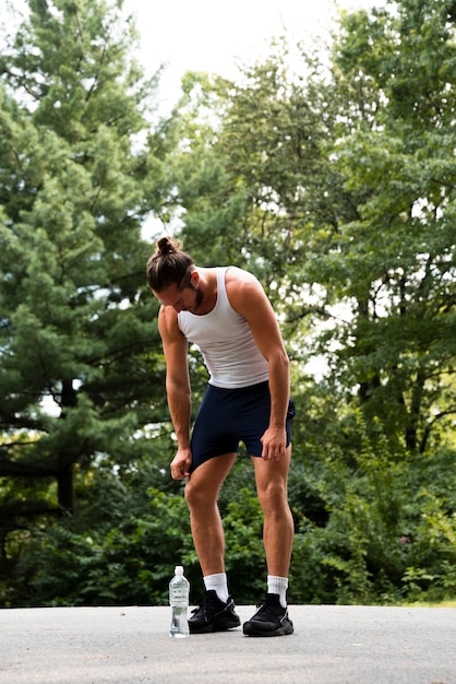 Full shot of runner in park