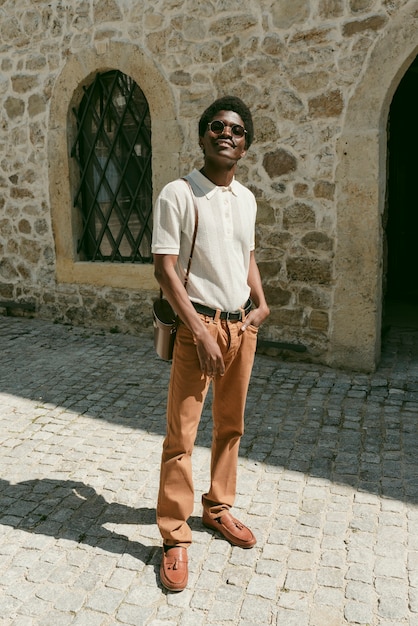 Full shot smiley black man posing