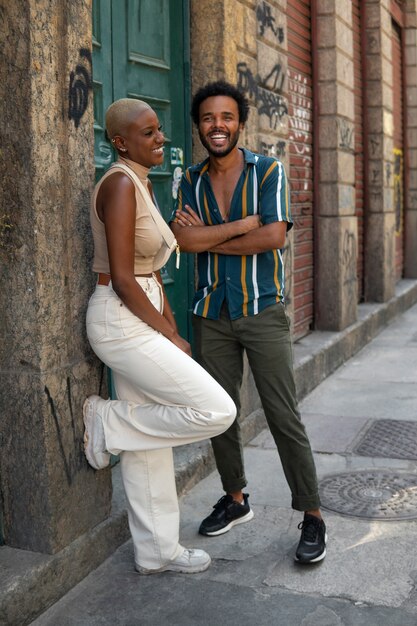 Full shot smiley couple outdoors