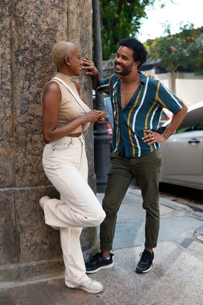 Full shot smiley couple outdoors
