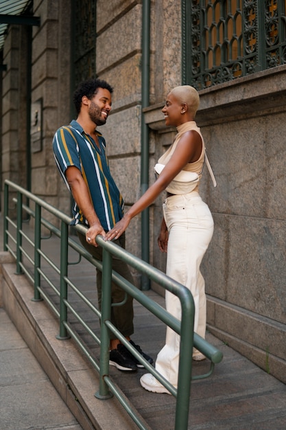 Full shot smiley couple outdoors