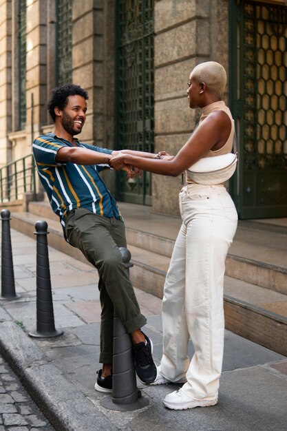 Full shot smiley couple outdoors