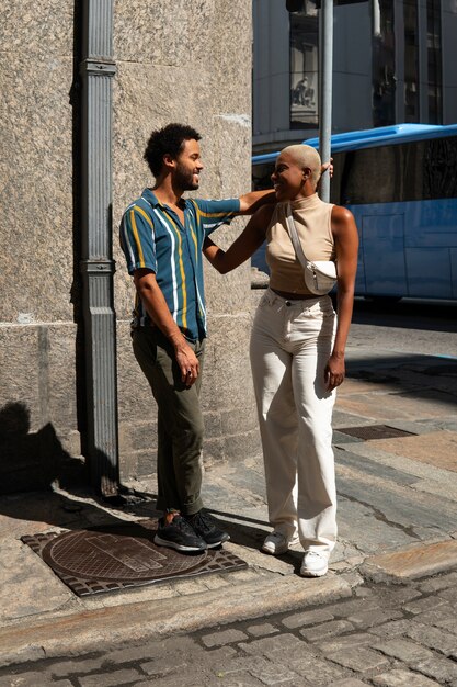 Full shot smiley couple outdoors