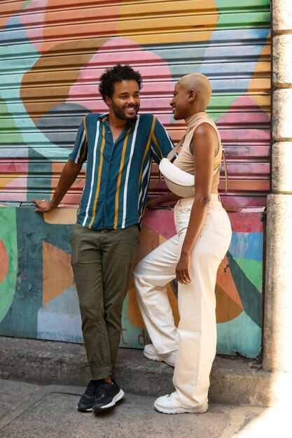full shot smiley couple outdoors