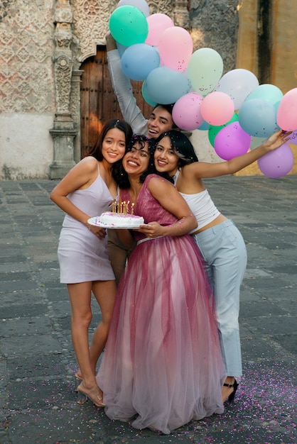 Full shot smiley friends celebrating birthday