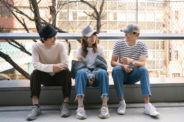 Full shot smiley friends with trucker hats