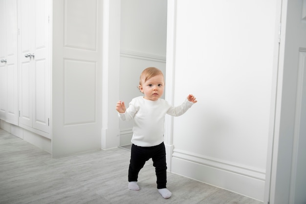 Full shot smiley kid walking indoors