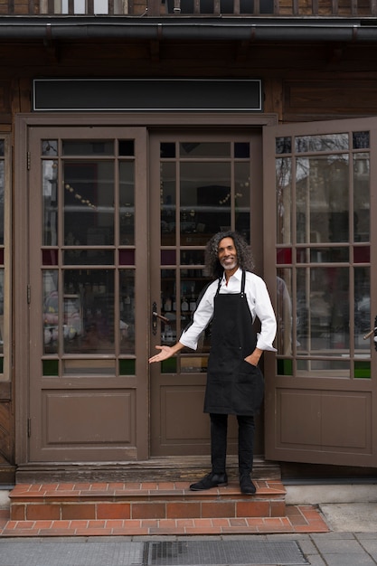 Full shot smiley man at door