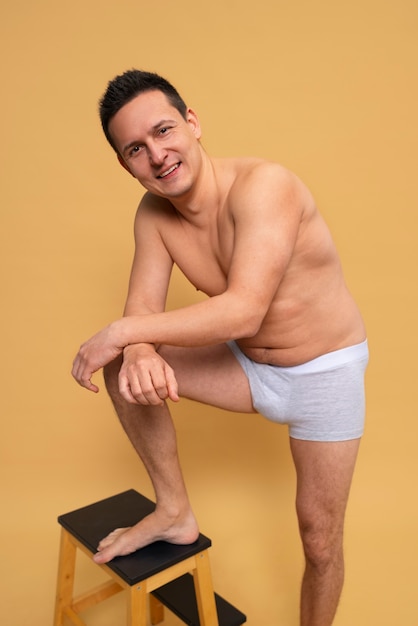 Full shot smiley man posing in studio