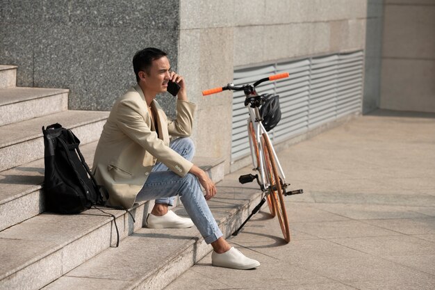 Free Photo full shot smiley man talking on phone