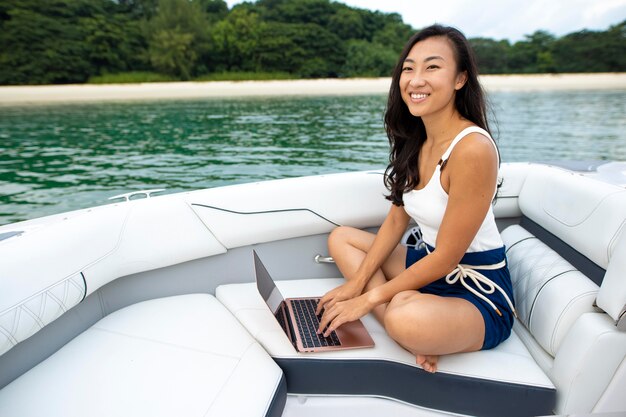 full shot smiley woman on boat