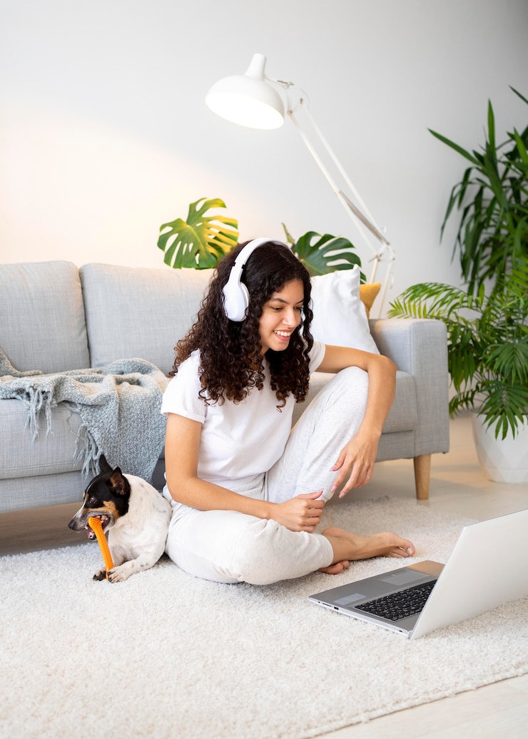 Free Photo full shot smiley woman on floor