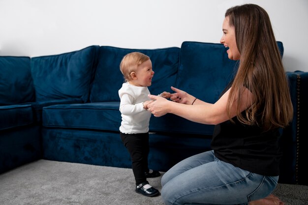 Full shot smiley woman and kid