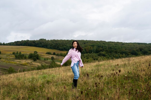 full shot smiley woman outdoors