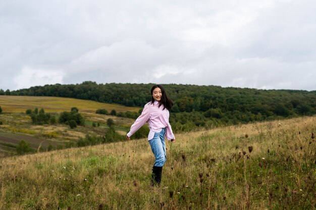 Full shot smiley woman outdoors