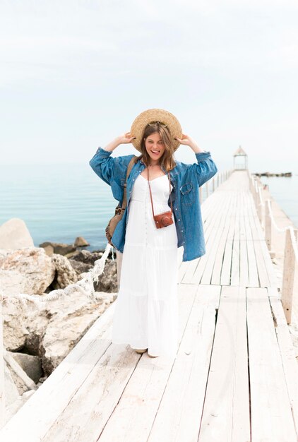 Full shot smiley woman posing outdoors