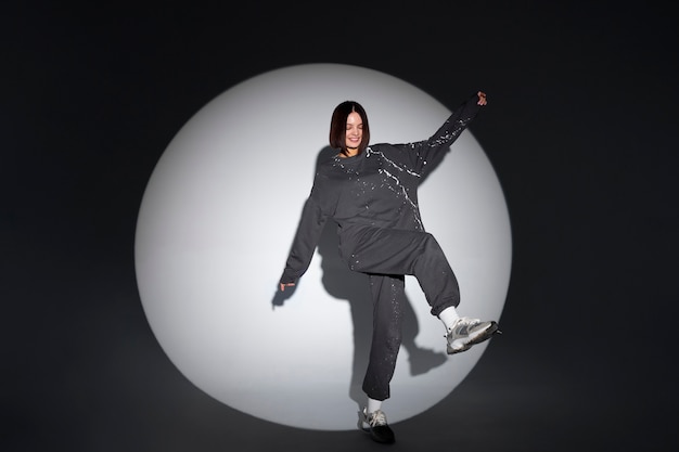 Full shot smiley woman posing in studio