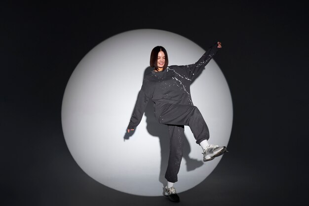 full shot smiley woman posing in studio