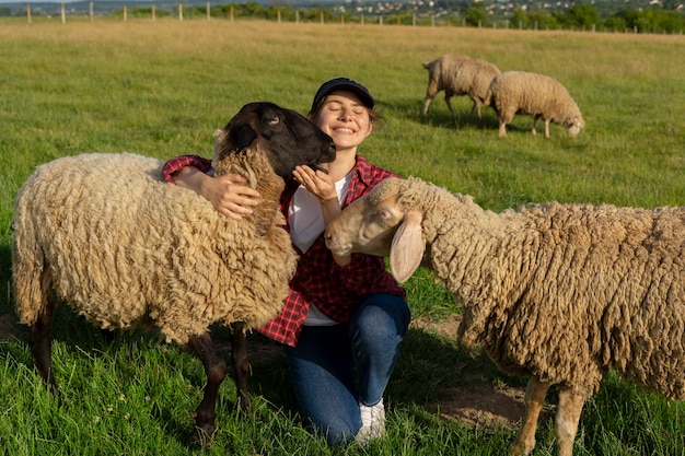 Full shot smiley woman sitting on grass