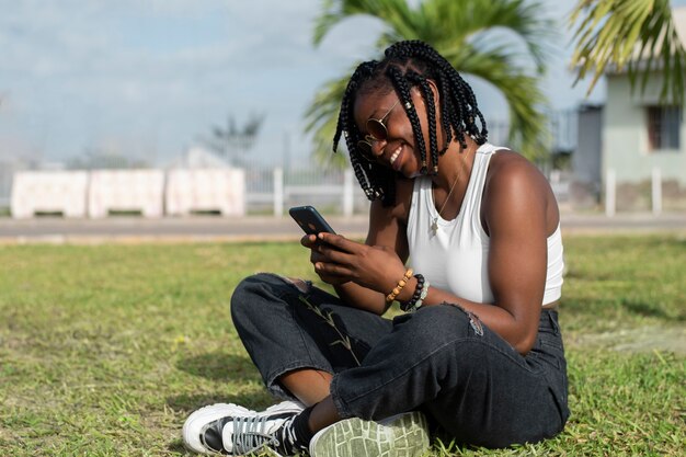 Full shot smiley woman texting