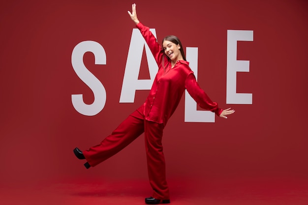 Full shot smiley woman wearing red clothes