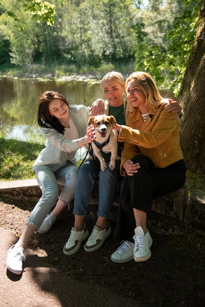 Full shot smiley women with cute dog