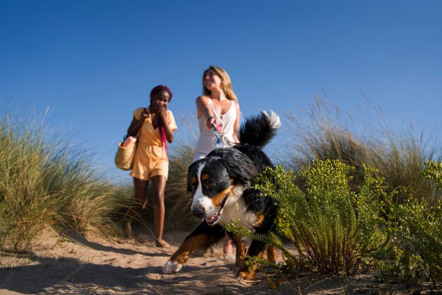 Full shot smiley women with cute dog