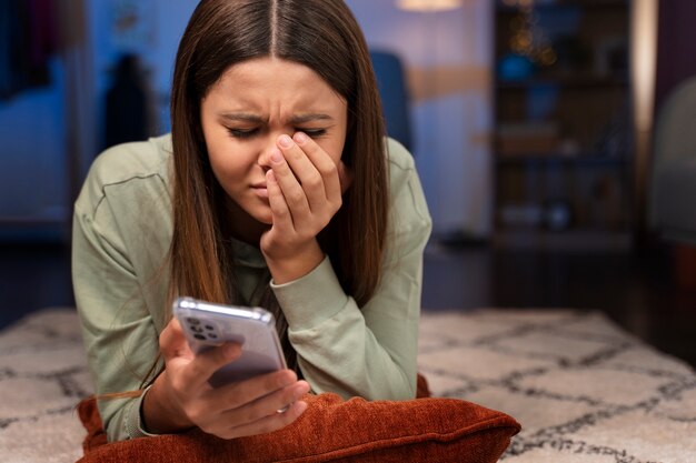 full shot suffering teenager being cyberbullied