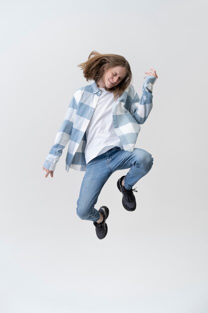 Full shot teenager jumping