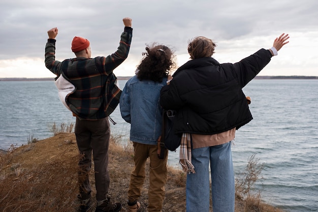 Full shot teens at seaside