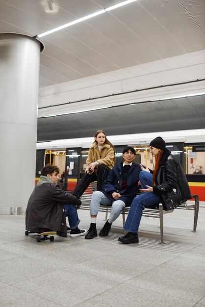 Full shot teens at subway station