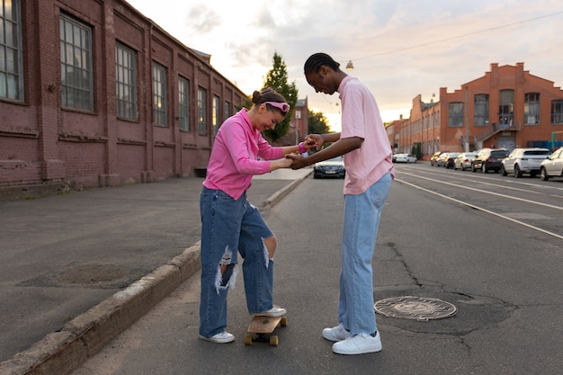 Free photo full shot teens wearing y2k  fashion