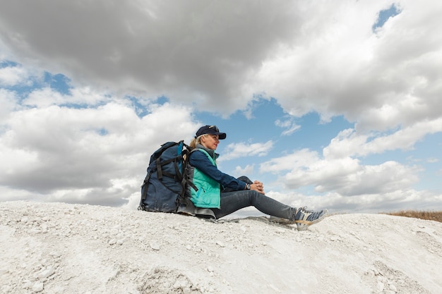 Full shot traveler sitting outdoor