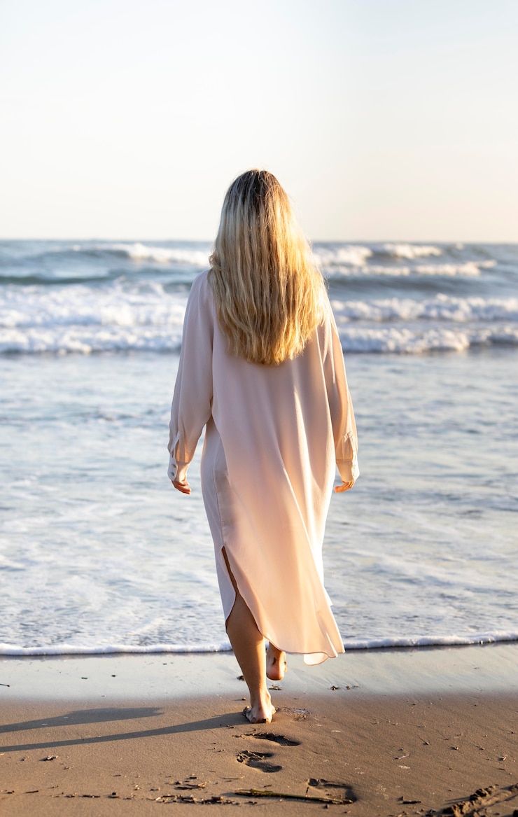 Free Photo full shot woman at the beach