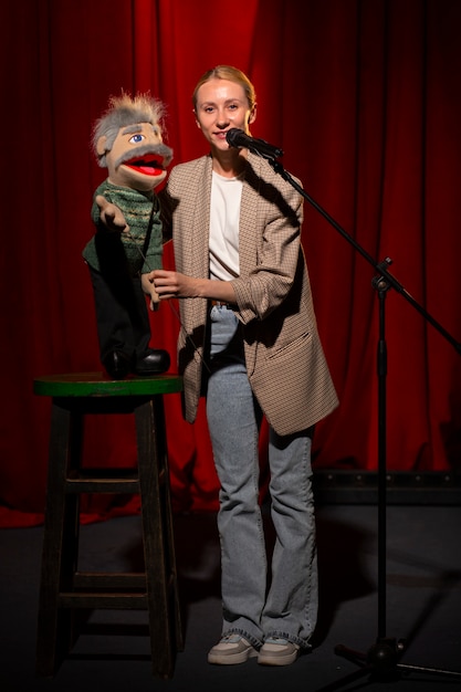 Full shot woman being ventriloquist