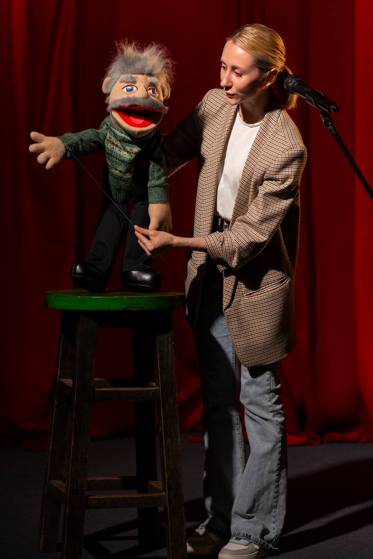 Free Photo full shot woman being ventriloquist