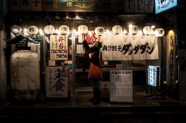 Full shot woman checking lamp