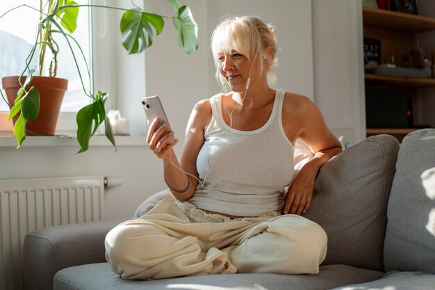 Full shot woman chilling at home