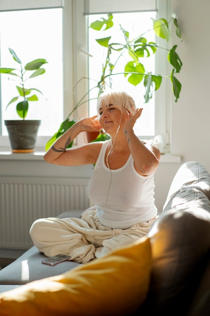 Full shot woman chilling at home