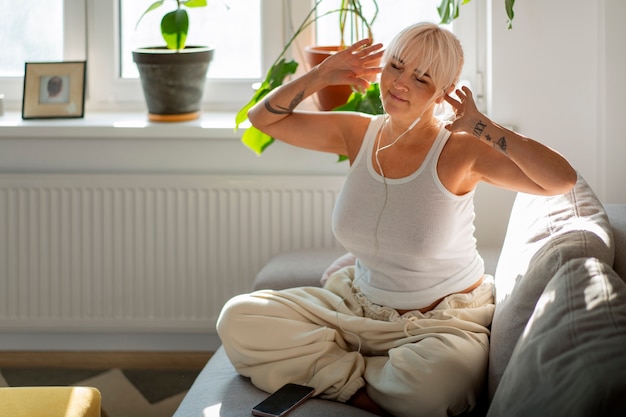 Full shot woman chilling at home