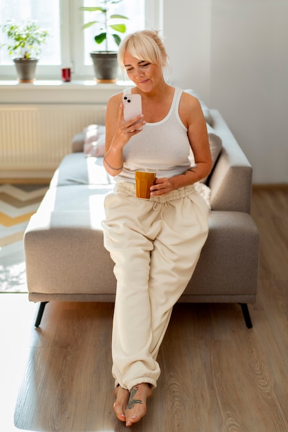 full shot woman chilling at home