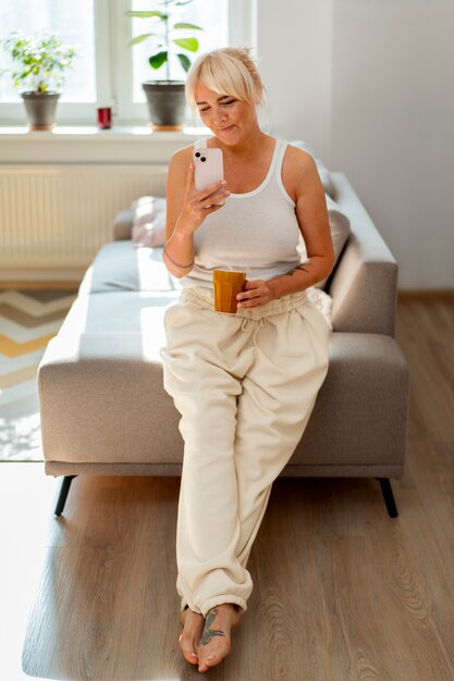 full shot woman chilling at home