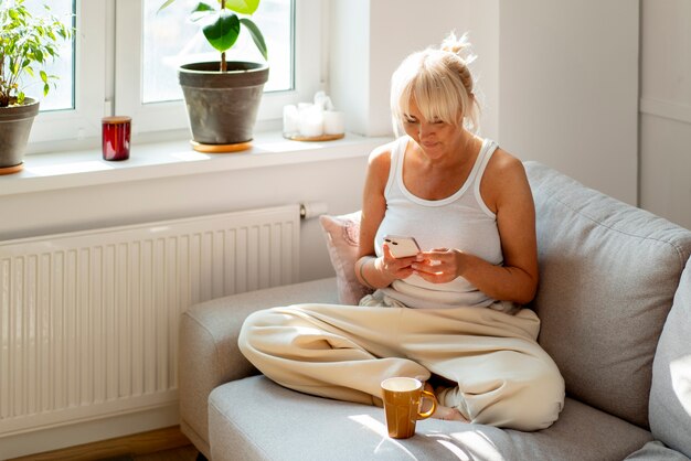 Full shot woman chilling at home
