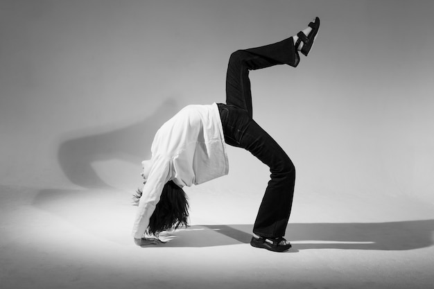 Full shot woman doing the bridge black and white