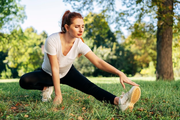 Full shot woman exercising outdoors