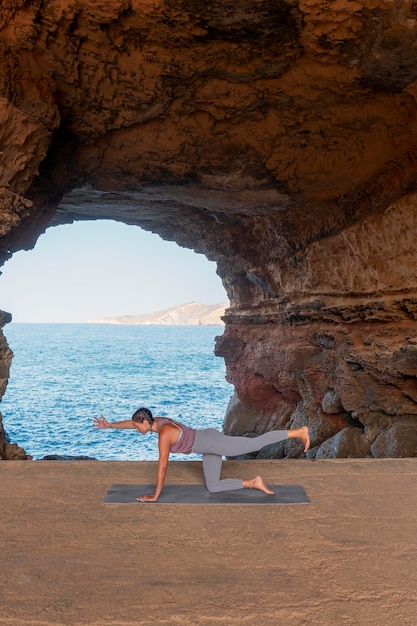 Free photo full shot woman exercising with view